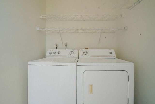 washroom with washer and dryer