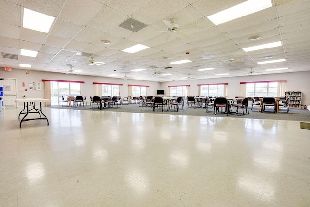 misc room with visible vents, a ceiling fan, and a paneled ceiling
