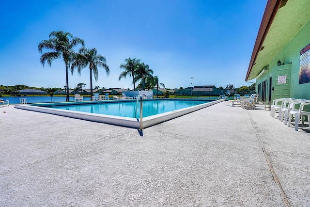 community pool featuring a patio area