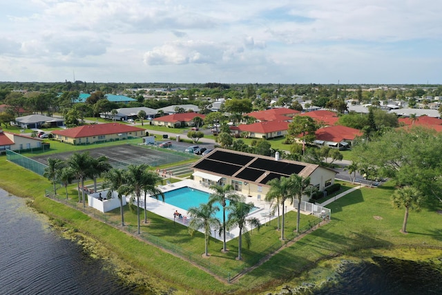 birds eye view of property with a residential view and a water view