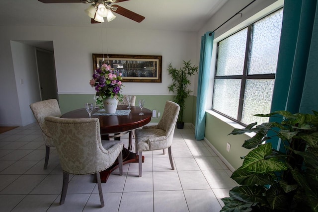dining area featuring plenty of natural light, a ceiling fan, and light tile patterned floors