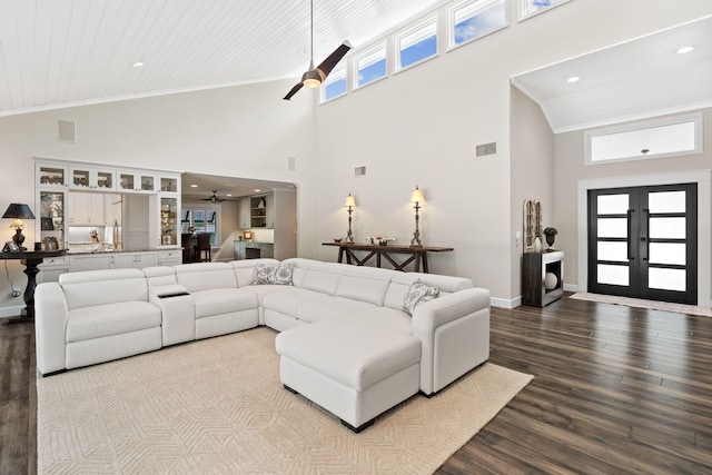 121 Hillcrest Dr, Sewalls Point, FL 34996 - living area with ceiling fan, high vaulted ceiling, wood finished floors, baseboards, and plenty of natural light