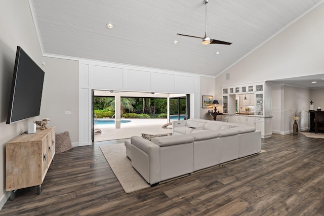 121 Hillcrest Dr, Sewalls Point, FL 34996 - living room with high vaulted ceiling, ceiling fan, dark wood-type flooring, baseboards, and ornamental molding