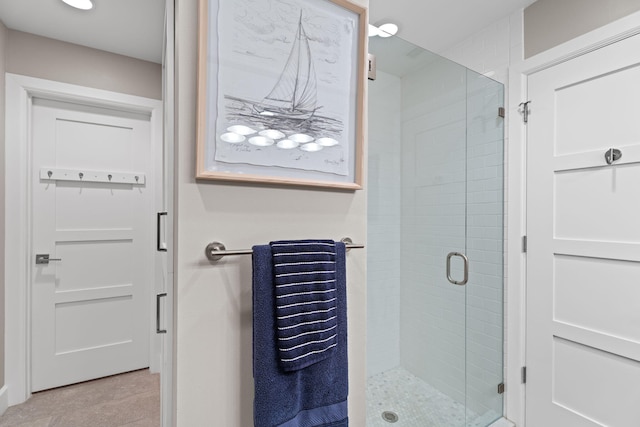 121 Hillcrest Dr, Sewalls Point, FL 34996 - bathroom featuring a stall shower and tile patterned floors
