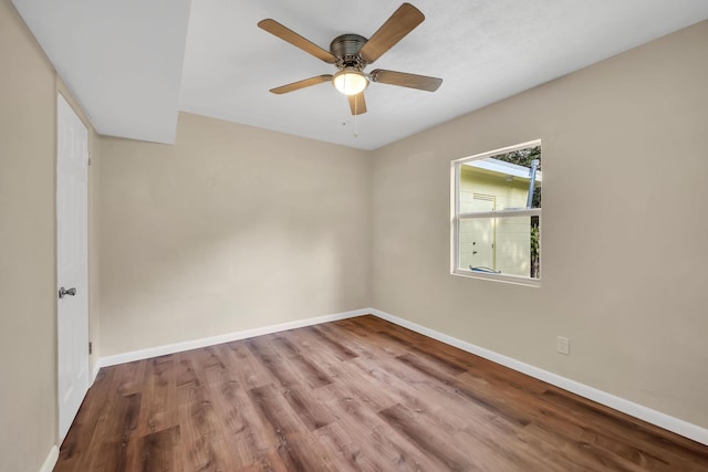 3205 Tennessee Ave, Fort Pierce, FL 34950 - empty room with baseboards, a ceiling fan, and wood finished floors