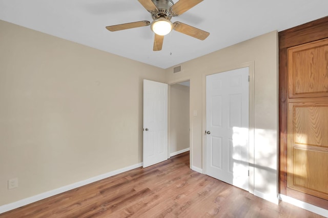 3205 Tennessee Ave, Fort Pierce, FL 34950 - unfurnished bedroom with baseboards, ceiling fan, light wood-style flooring, and visible vents