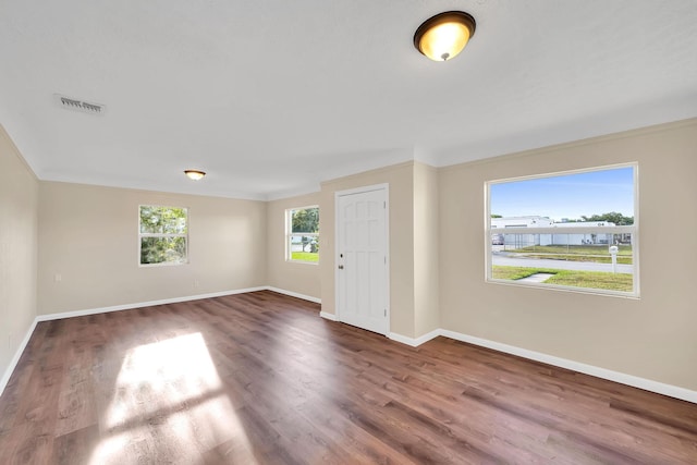 3205 Tennessee Ave, Fort Pierce, FL 34950 - foyer with baseboards, wood finished floors, and visible vents