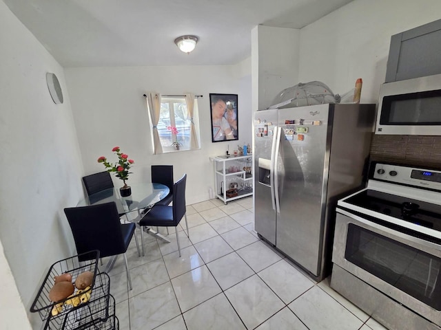10090 W Fern St, Miami, FL 33157 - kitchen featuring appliances with stainless steel finishes and light tile patterned floors