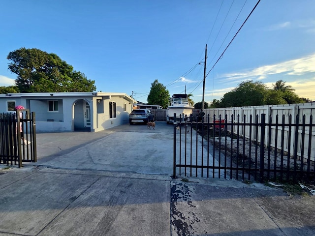 10090 W Fern St, Miami, FL 33157 - exterior space with a fenced front yard, stucco siding, and concrete driveway