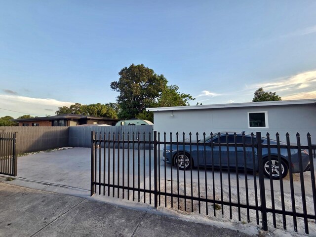 10090 W Fern St, Miami, FL 33157 - view of gate featuring a fenced front yard