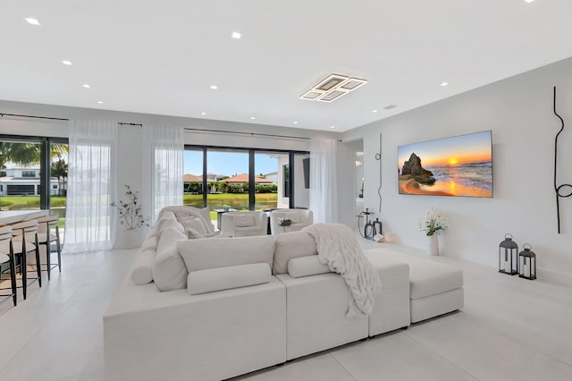 tiled living area with a wealth of natural light and visible vents
