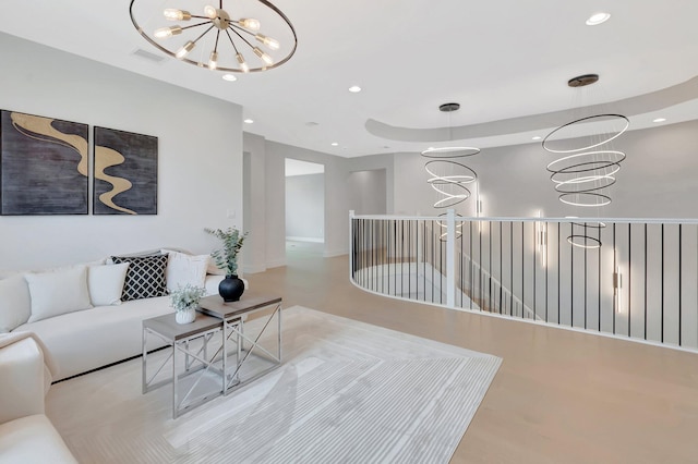 living room featuring recessed lighting, an inviting chandelier, and visible vents