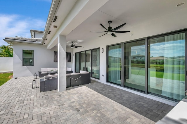 view of patio with a ceiling fan and outdoor lounge area