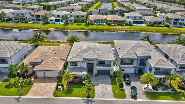 aerial view featuring a residential view and a water view