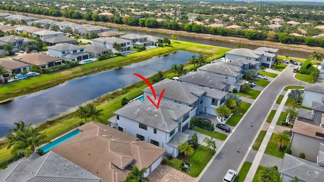 aerial view with a water view and a residential view