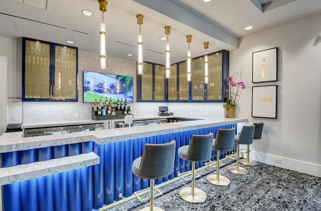 bar featuring recessed lighting, baseboards, and pendant lighting