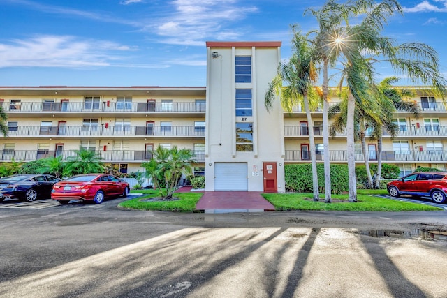view of property with uncovered parking