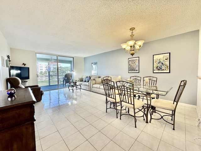 dining room with a textured ceiling, a chandelier, and light tile patterned floors