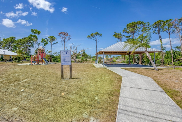 view of community with a yard, a gazebo, and playground community
