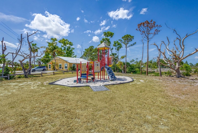 community playground featuring a lawn