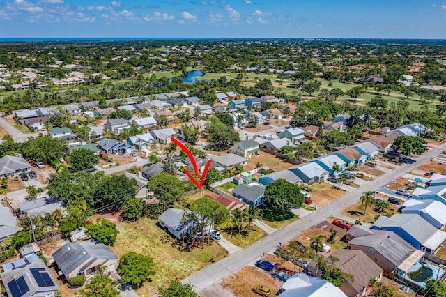 aerial view featuring a water view and a residential view
