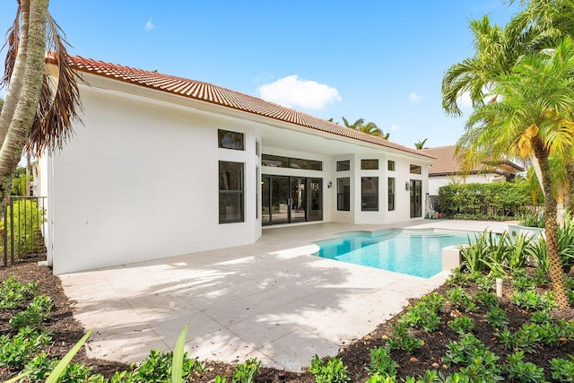 6581 Grande Orchid Way, Delray Beach, FL 33446 - back of house with a patio area, a tile roof, and stucco siding