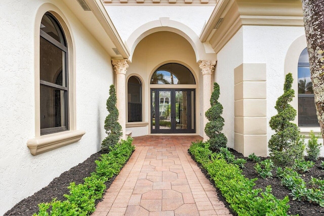 6581 Grande Orchid Way, Delray Beach, FL 33446 - view of exterior entry featuring stucco siding and french doors