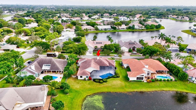 bird's eye view with a residential view and a water view