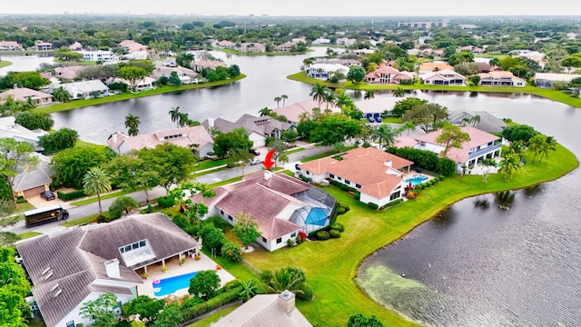 bird's eye view featuring a residential view and a water view