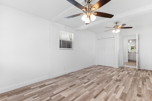 9603 NW 72nd Mnr, Tamarac, FL 33321 - unfurnished bedroom featuring ceiling fan, light wood-type flooring, beam ceiling, baseboards, and a closet