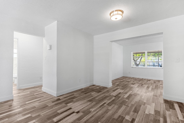 9603 NW 72nd Mnr, Tamarac, FL 33321 - empty room featuring baseboards and wood finished floors