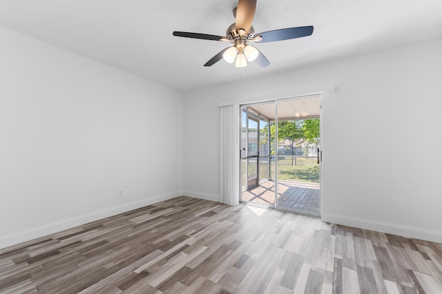 9603 NW 72nd Mnr, Tamarac, FL 33321 - spare room featuring baseboards, ceiling fan, and wood finished floors