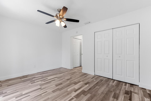9603 NW 72nd Mnr, Tamarac, FL 33321 - unfurnished bedroom featuring a ceiling fan, visible vents, light wood-type flooring, baseboards, and a closet