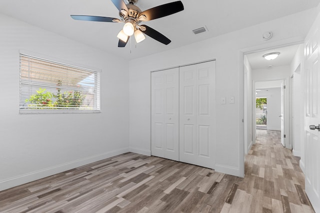 9603 NW 72nd Mnr, Tamarac, FL 33321 - unfurnished bedroom with baseboards, a closet, light wood-style flooring, and visible vents