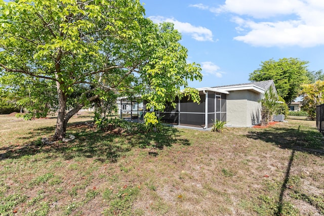 9603 NW 72nd Mnr, Tamarac, FL 33321 - view of yard with a sunroom