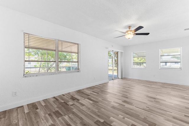 9603 NW 72nd Mnr, Tamarac, FL 33321 - unfurnished room with baseboards, ceiling fan, wood finished floors, and visible vents