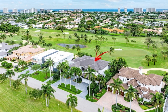 birds eye view of property with view of golf course, a water view, a view of city, and a residential view