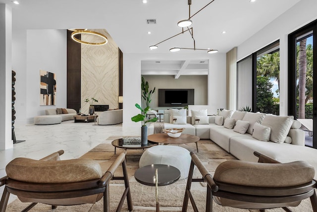 building lobby with recessed lighting, beam ceiling, and coffered ceiling