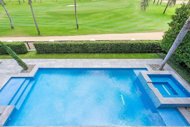 view of pool with view of golf course, an area to practice putting, and a pool with connected hot tub