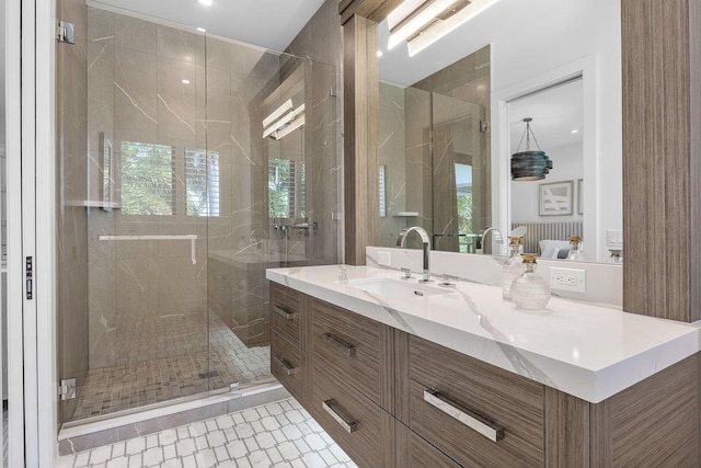 full bathroom with a stall shower, tile patterned flooring, vanity, healthy amount of natural light, and recessed lighting