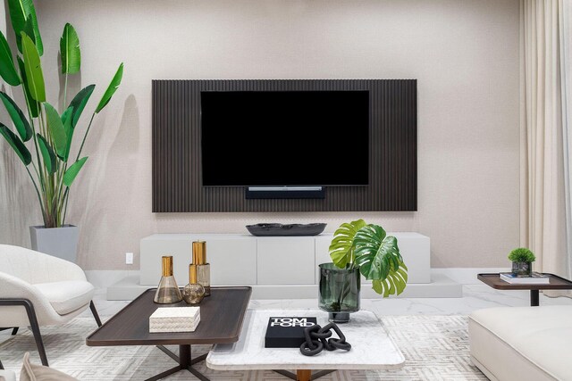 living room with baseboards and marble finish floors