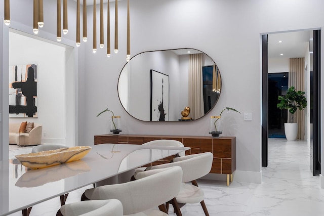 bathroom with marble tiled flooring and baseboards