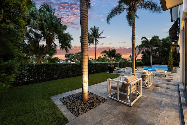 view of patio terrace at dusk