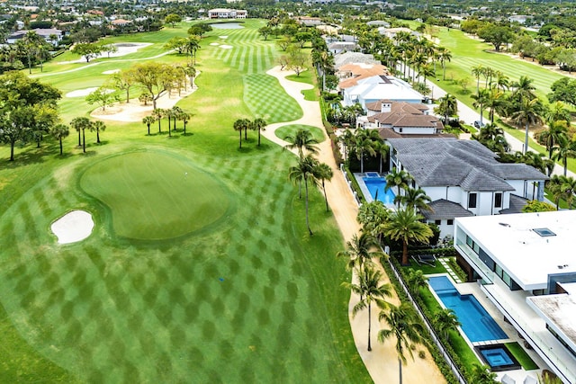 bird's eye view of a golf club and a pool