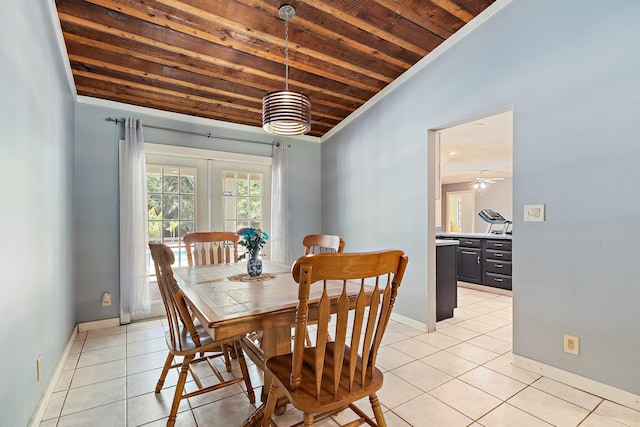 dining room featuring baseboards, light tile patterned floors, lofted ceiling, and wooden ceiling