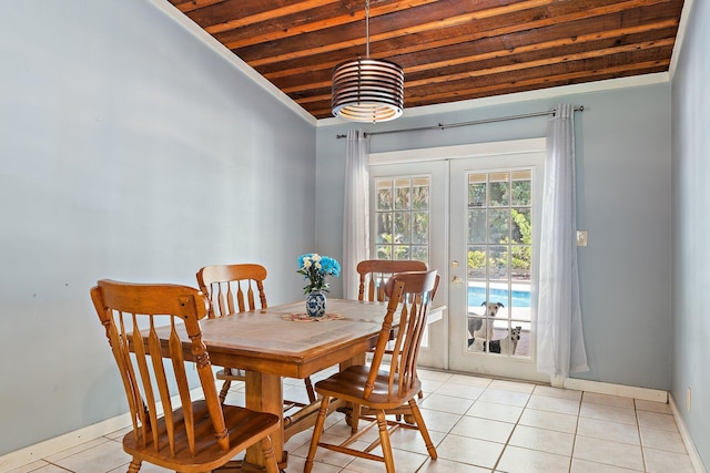 dining area with french doors, baseboards, wooden ceiling, light tile patterned floors, and vaulted ceiling