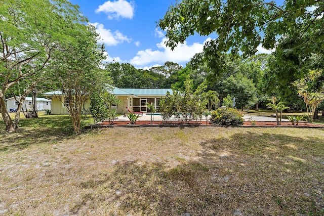 view of yard featuring an outdoor pool