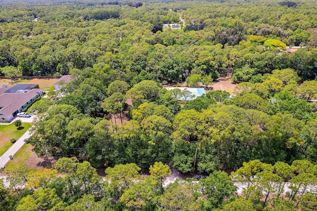aerial view with a wooded view