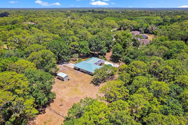 drone / aerial view featuring a view of trees