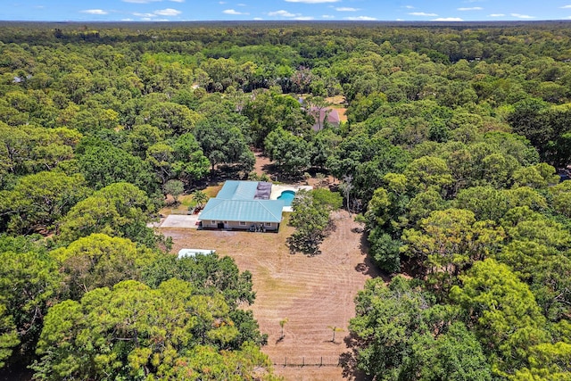 birds eye view of property with a wooded view